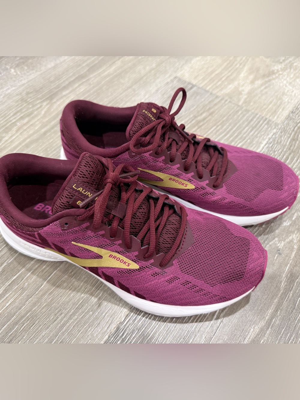 Brooks Womenโs Running Shoes in Burgundy with Gold Logos